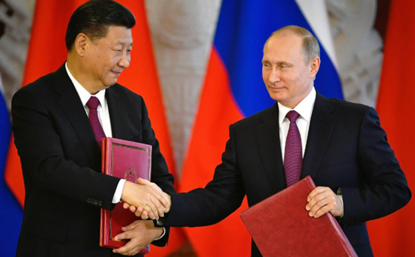 Xi discute commerce et Corée du Nord avec Poutine
